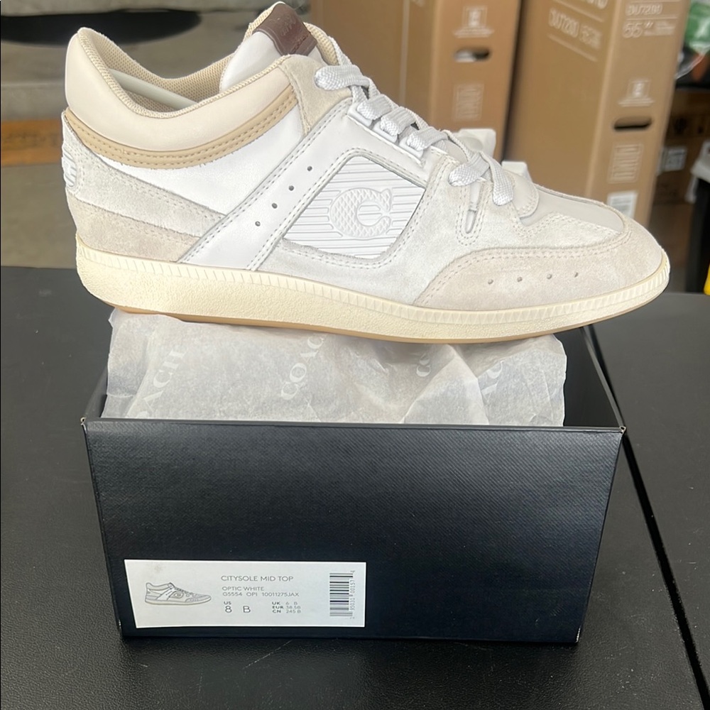 Coach women’s city sole mid top Sneakers
